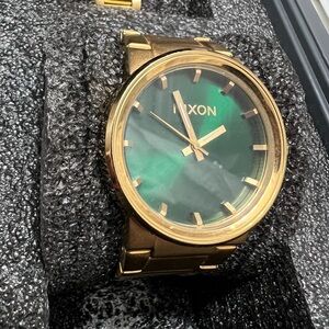 Nixon green face gold watch